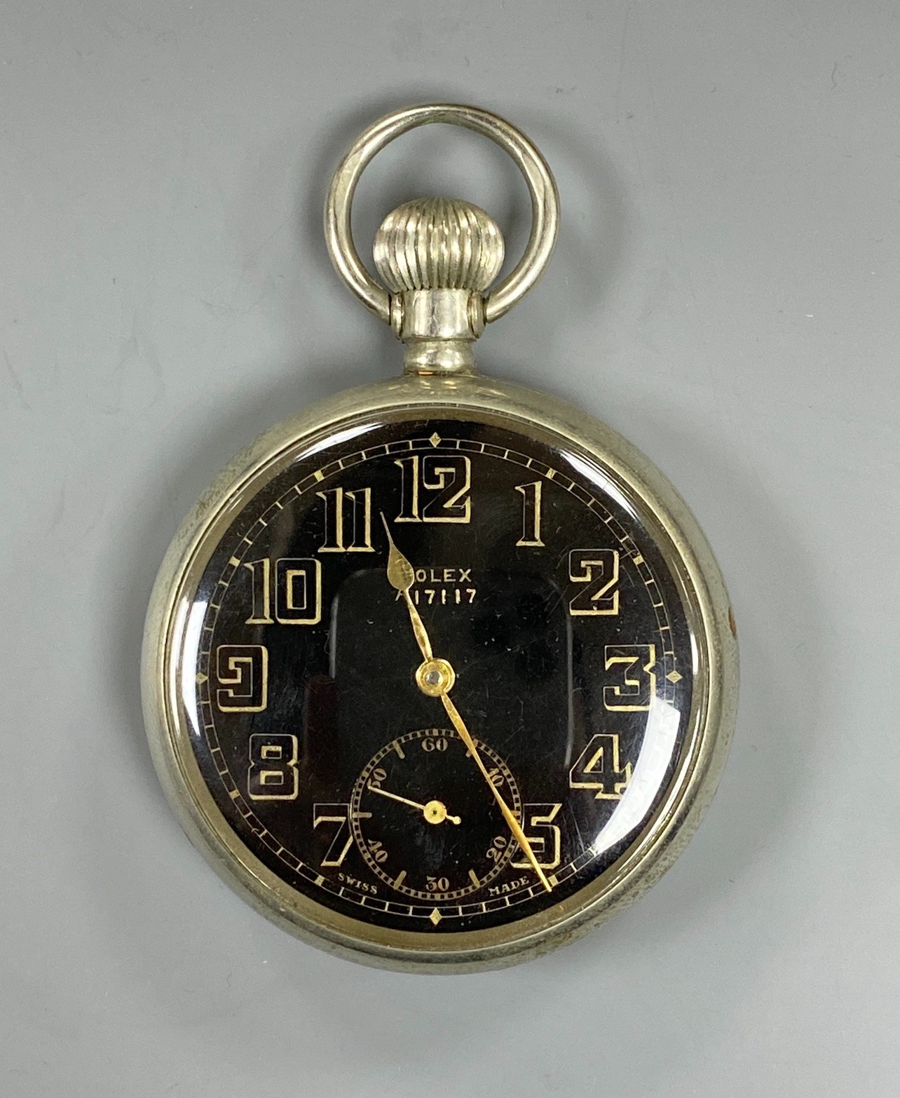 A mid 20th century nickel cased Rolex military issue open faced pocket watch, with black dial, case back with engraved broad arrow and numbered A.17117 G.S.MK.11, case diameter 50mm.